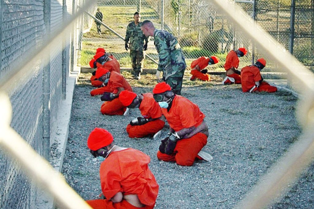 251009-Guantanamo-Bay-camp-x-ray-blindfolded-prisoners-2002-ac-1023p-de29fa.jpg